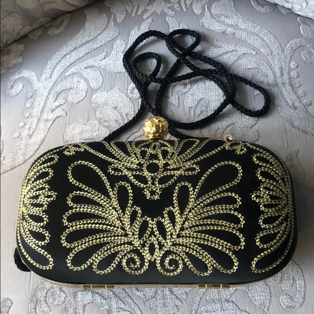 Black and gold cocktail purse. 6.5 in x 3 in.